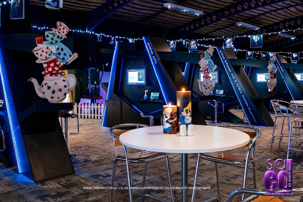 Alice in Wonderland Pillar candles and teapot cutouts paired with minimal hightop setup designed by SA Event Decor