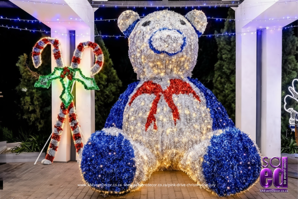 Giant lit up Tinsle bear paired with Candy cane display designed by SA Event Decor